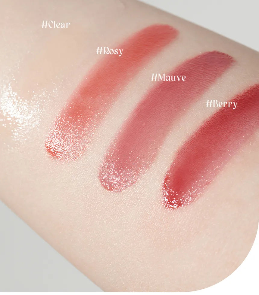 Four swatches of lip gloss on a skin-like background labeled 'Clear', 'Rosy', 'Mauve', and 'Berry'.